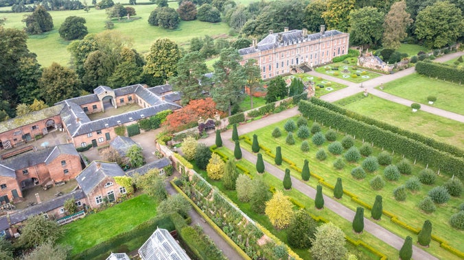 An aerial view of the house and garden at Erddig in autumn.